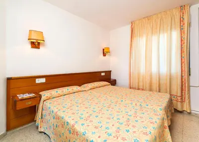 Cama o camas de una habitación en Apartamentos Guitart