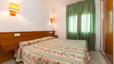 Cama o camas de una habitación en Apartamentos Guitart