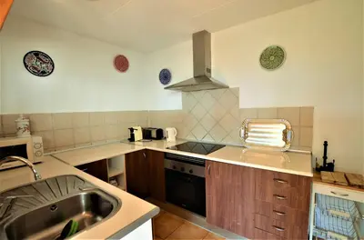 Una cocina o zona de cocina en VILLA FLORES 8 personas LLORET DE MAR