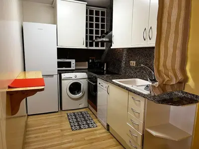 Una cocina o zona de cocina en Hermoso apartamento con piscina a 300m de la playa