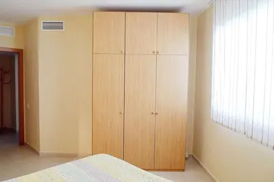 Cama o camas de una habitación en Precioso apartamento con piscina y jardín propio