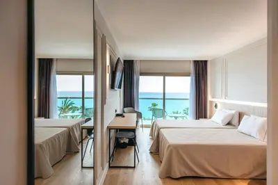 Cama o camas de una habitación en Hotel Miramar