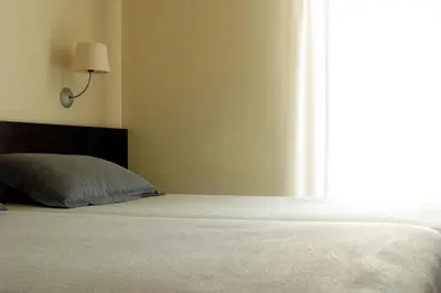 Cama o camas de una habitación en Hotel Torres