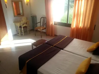 Cama o camas de una habitación en Hotel Hostal del Sol