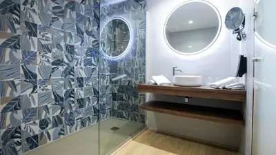 Un baño de Evenia Olympic Suites