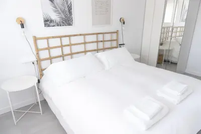 Cama o camas de una habitación en Apartamento con Parking a 50m de la playa