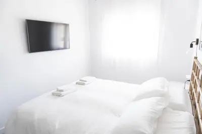Cama o camas de una habitación en Apartamento con Parking a 50m de la playa