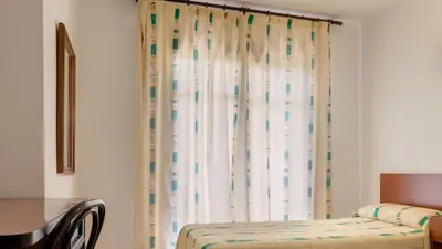 Cama o camas de una habitación en htop Planamar #htopEnjoy