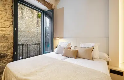 Cama o camas de una habitación en Gaia Apartments & Lofts Girona