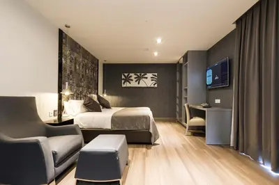 Una televisión o centro de entretenimiento en Sant Jordi Boutique Hotel