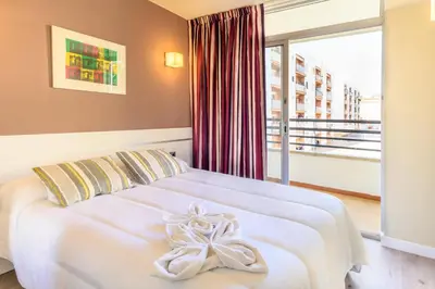 Cama o camas de una habitación en Medplaya Aparthotel Esmeraldas