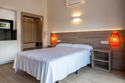 Cama o camas de una habitación en Medplaya Aparthotel Sant Eloi