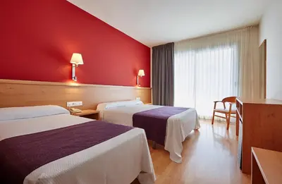Cama o camas de una habitación en Hotel Surf Mar