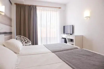 Cama o camas de una habitación en KAKTUS Hotel Volga