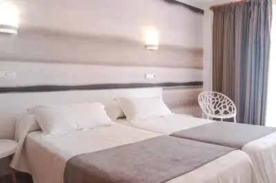 Cama o camas de una habitación en KAKTUS Hotel Volga
