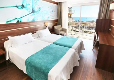 Cama o camas de una habitación en KAKTUS Hotel Volga