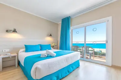 Cama o camas de una habitación en ALEGRIA Maripins