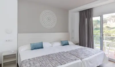 Cama o camas de una habitación en Hotel Oasis Park Splash