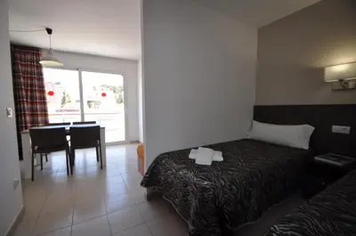 Cama o camas de una habitación en Aparthotel Safari