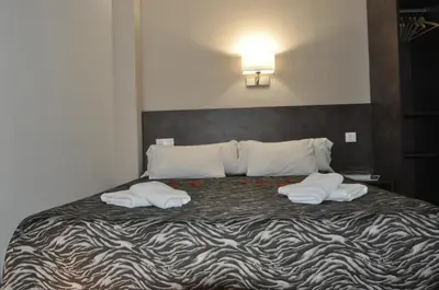 Cama o camas de una habitación en Aparthotel Safari