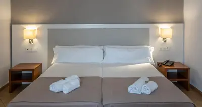 Cama o camas de una habitación en Rosamar & Spa 4*s