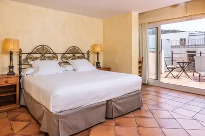 Cama o camas de una habitación en RVHotels Vila de Tossa