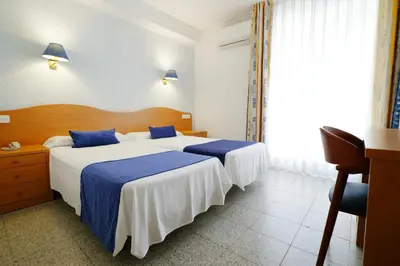 Cama o camas de una habitación en Hotel Internacional