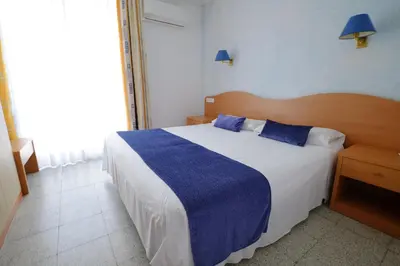 Cama o camas de una habitación en Hotel Internacional