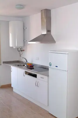 Una cocina o zona de cocina en Aparthotel Iris