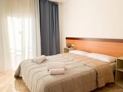 Cama o camas de una habitación en Apartamentos OlaMar