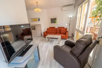 Una televisión o centro de entretenimiento en HomeHolidaysRentals SantMartin - Costa Barcelona