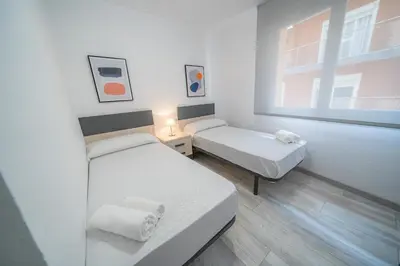 Cama o camas de una habitación en HomeHolidaysRentals SantMartin - Costa Barcelona