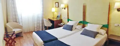 Cama o camas de una habitación en Hotel Rosa & Spa Begur