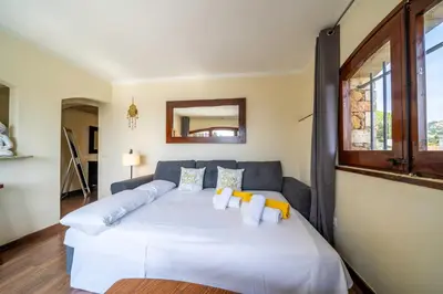 Cama o camas de una habitación en Villa Can Toni Vistas Mar Piscina Jacuzzi Aire Acondicionado