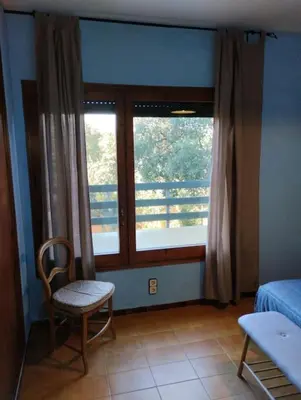 Cama o camas de una habitación en Casa adossada de camp prop de la Costa Brava