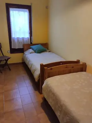 Cama o camas de una habitación en Casa adossada de camp prop de la Costa Brava