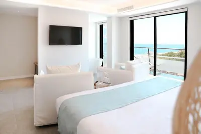 Cama o camas de una habitación en KAKTUS Hotel Kaktus Playa