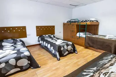 Cama o camas de una habitación en Can Bugantó - amplia casa con piscina y jardín