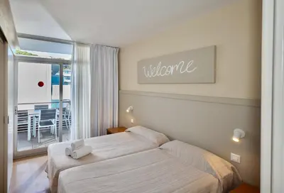 Cama o camas de una habitación en Aparthotel Comtat Sant Jordi