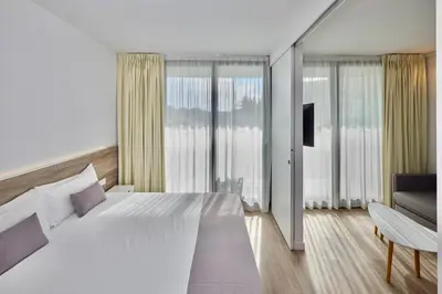 Cama o camas de una habitación en Aparthotel Comtat Sant Jordi