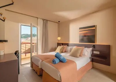 Cama o camas de una habitación en AQUA Hotel Promenade & Spa 4Sup