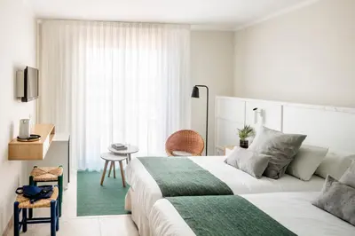 Cama o camas de una habitación en AQUA Hotel Bertran Park