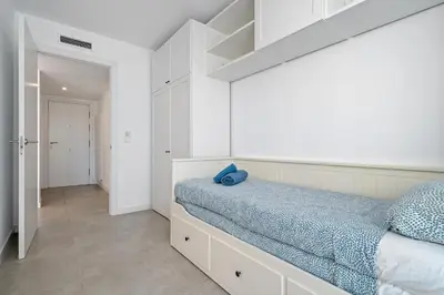 Cama o camas de una habitación en Hauzify I Apartament Jardins d'Aro