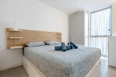Cama o camas de una habitación en Hauzify I Apartament Jardins d'Aro