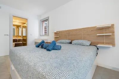 Cama o camas de una habitación en Hauzify I Apartament Jardins d'Aro