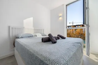Cama o camas de una habitación en Hauzify I Apartament Jardins d'Aro