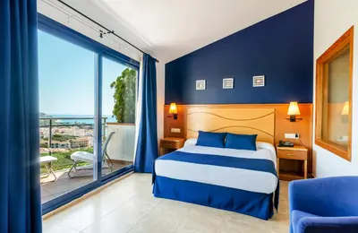 Cama o camas de una habitación en Hotel Garbi