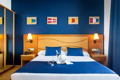 Cama o camas de una habitación en Hotel Garbi