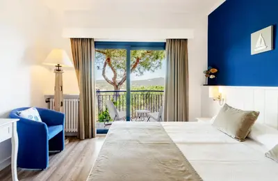 Cama o camas de una habitación en Hotel Garbi