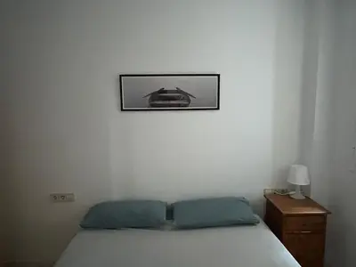Cama o camas de una habitación en Céntrico apartamento a 150 metros de la playa. Parking*